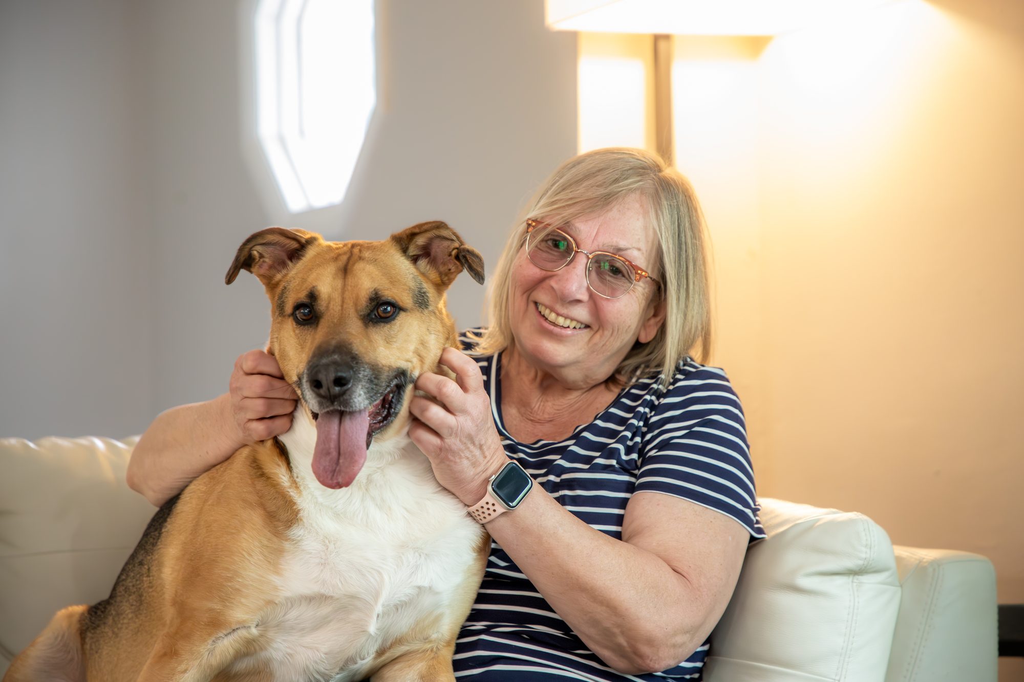 Mama Sue holding Norbert's face gently in warm golden light